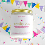 Birthday wish candle in a jar scented like vanilla buttercream frosting on a freshly-baked birthday cake. 
