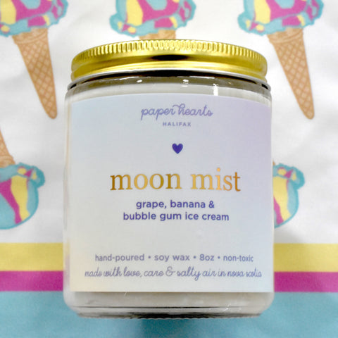 Moon mist candle in a jar scented like grape, banana, and bubble gum ice cream. 