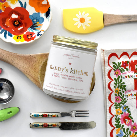 Nanny's kitchen candle in a jar scented like sugar cookies, warm spices, and freshly-baked cinnamon buns. 